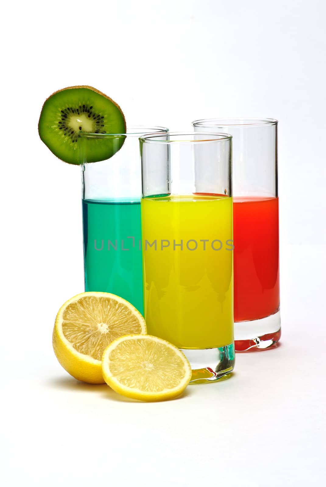 cocktail in three glasses and lemon isolated
