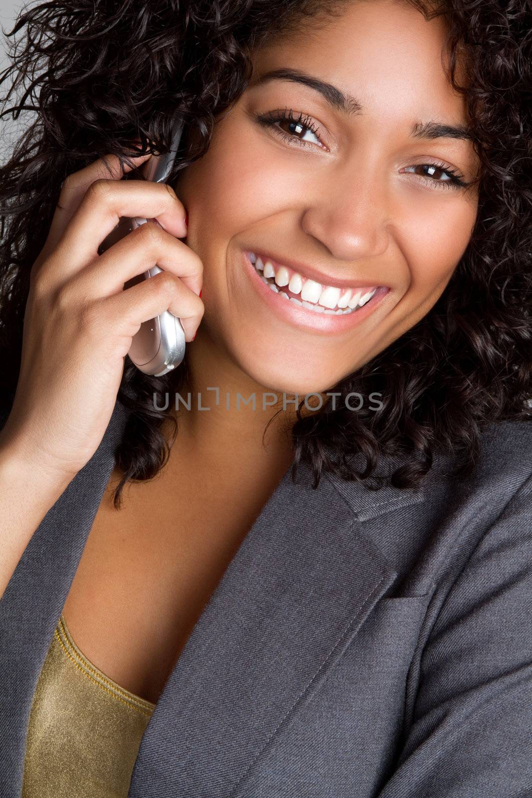 Smiling black woman on cell phone