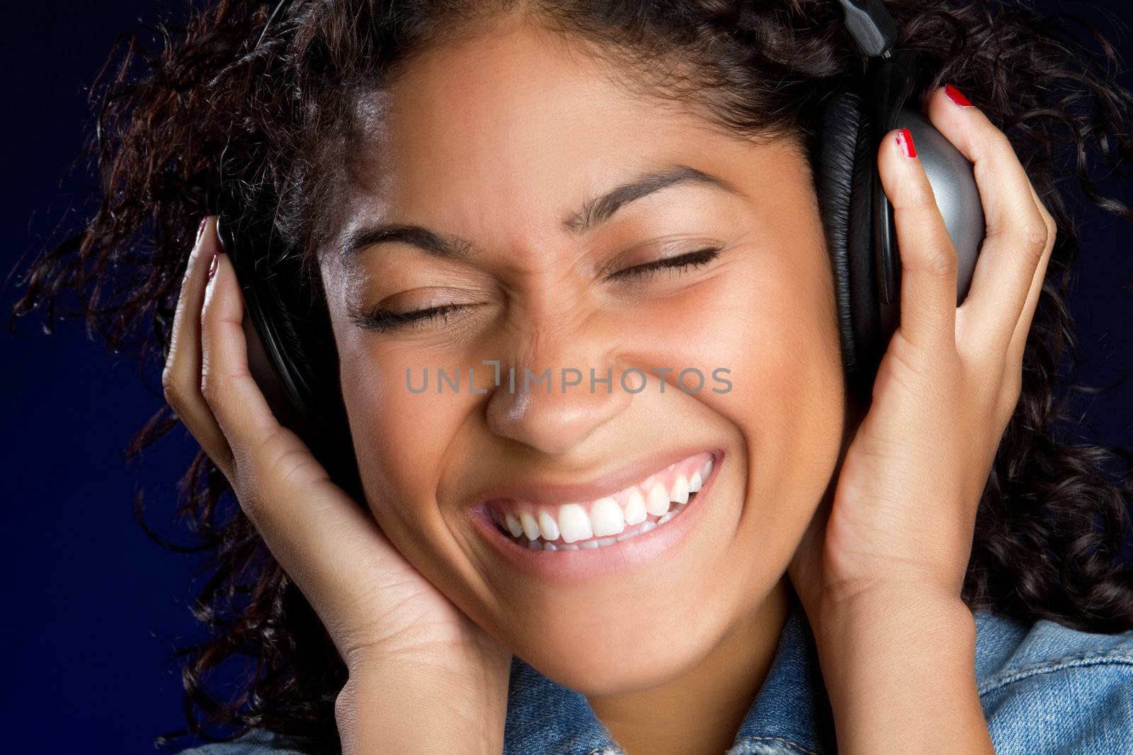 Smiling girl listening to headphones music