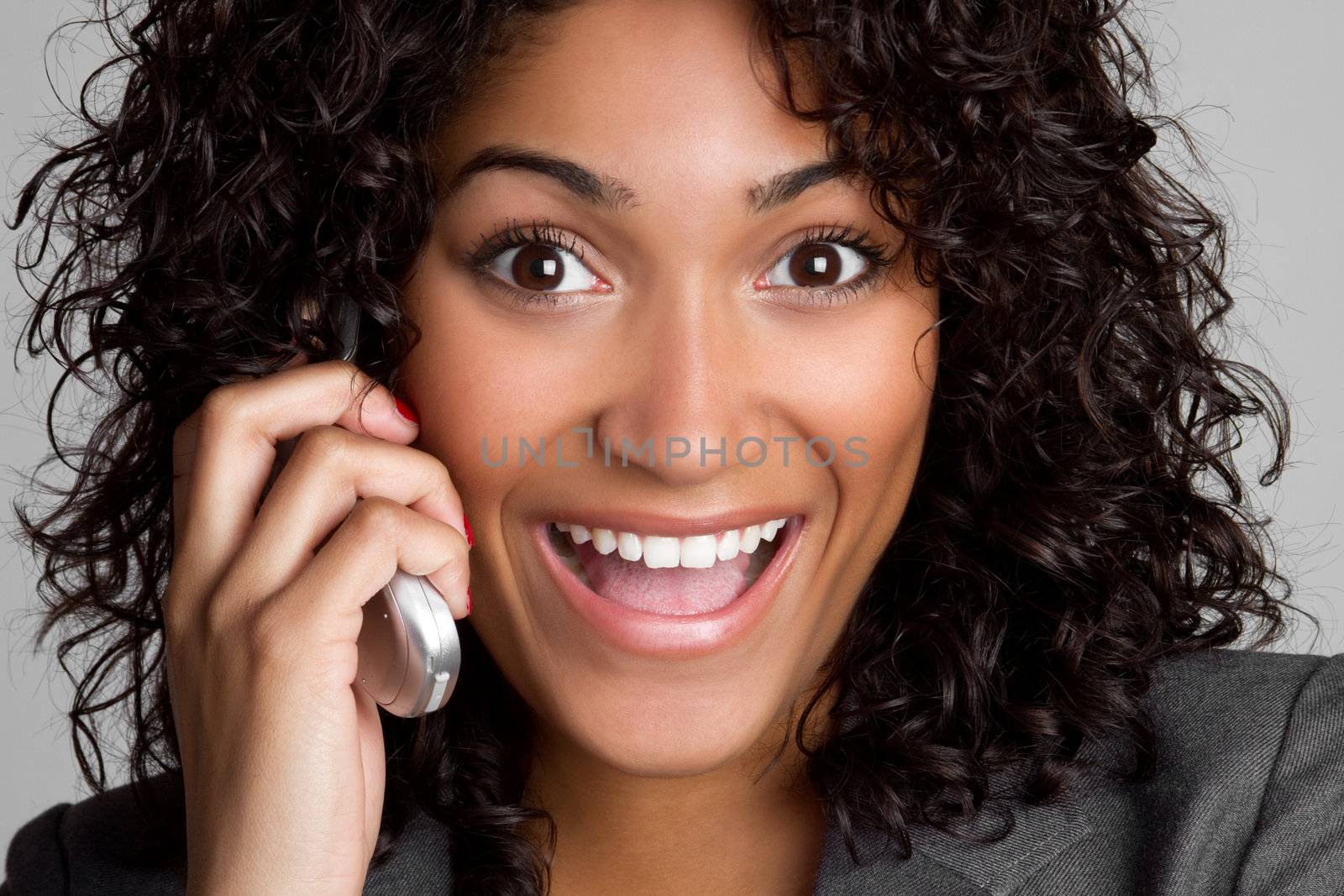 Happy black woman on cell phone