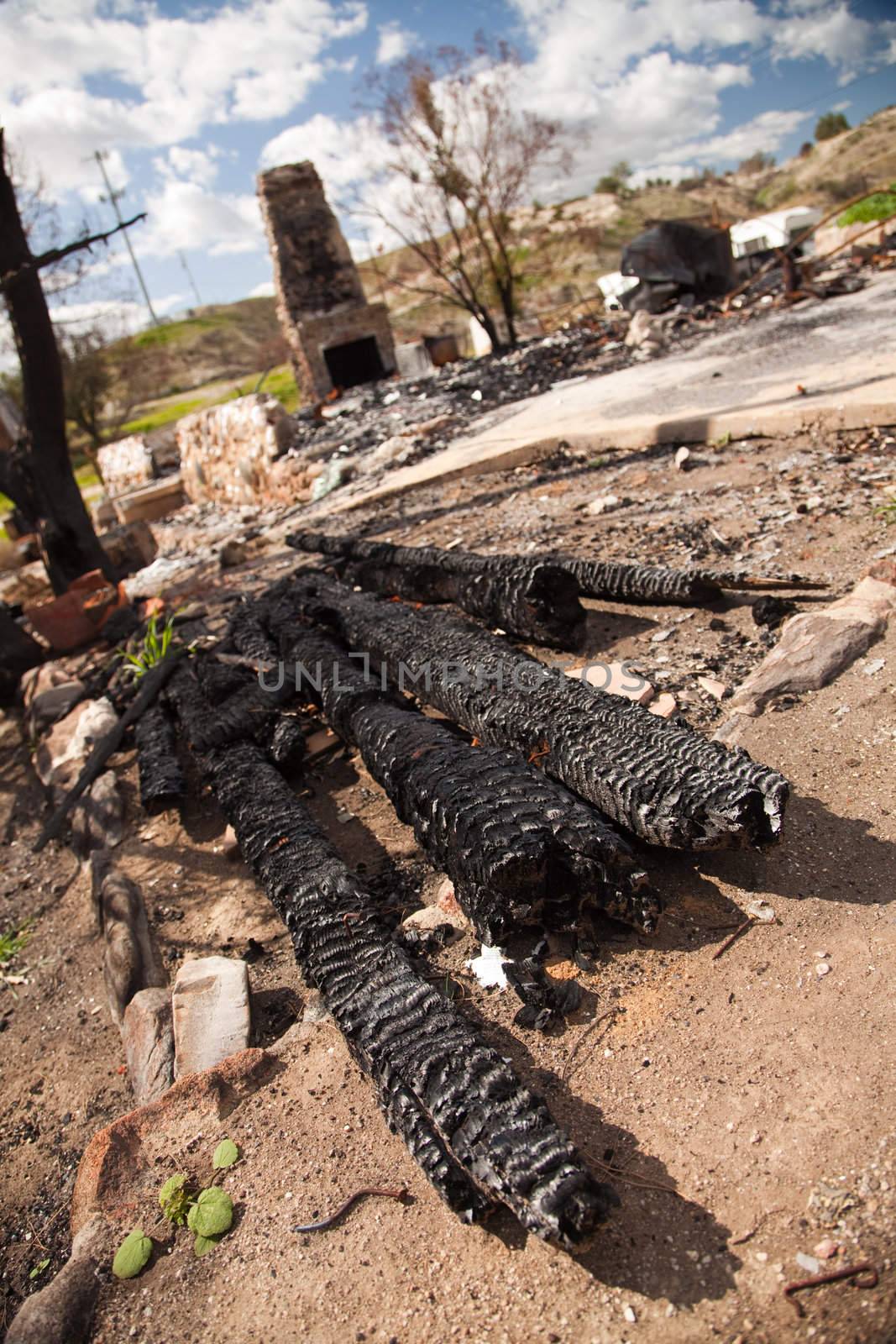 Remains of a Burned Down House with Brick Fireplace Standing.