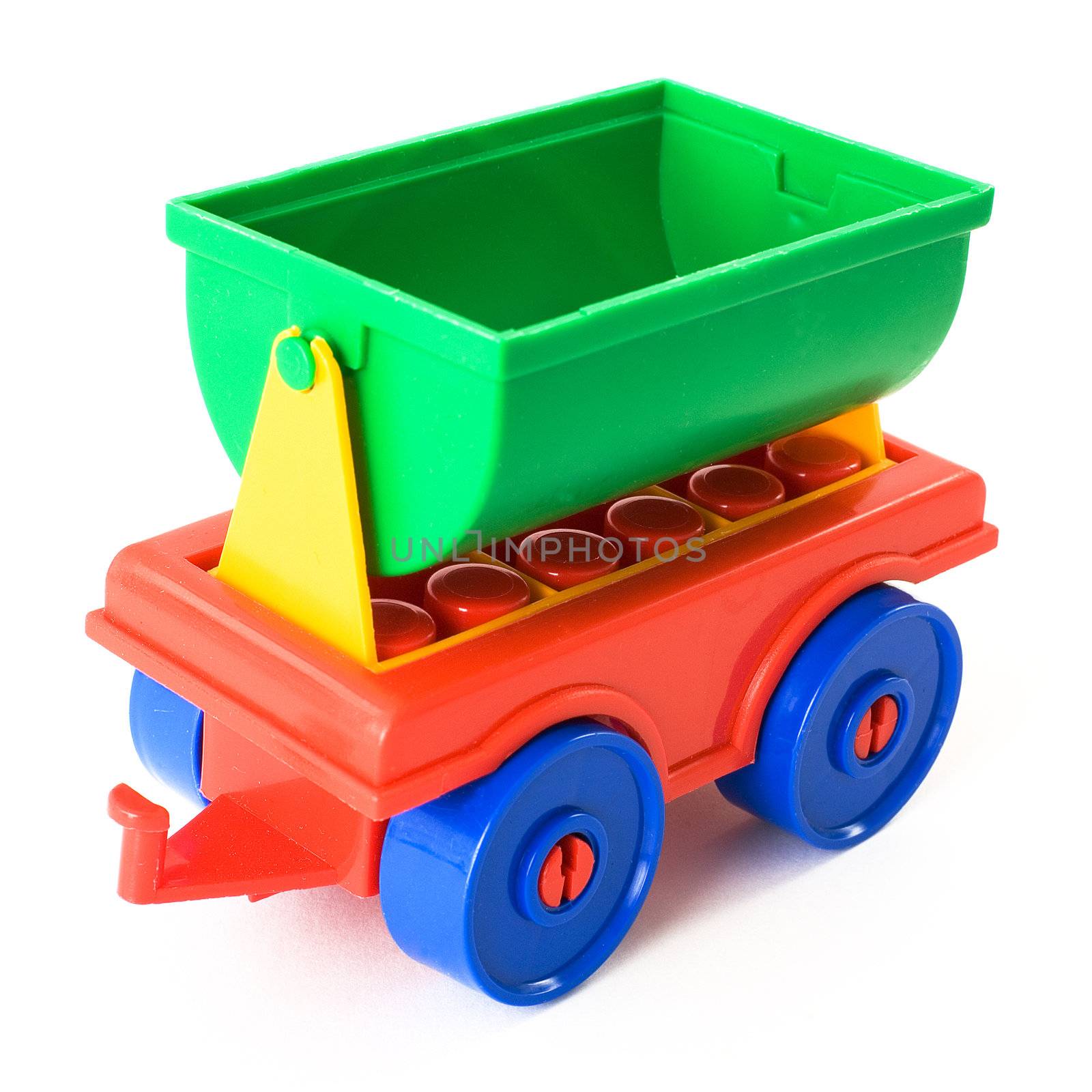 Nursery multi-coloured toy trailer on a white background