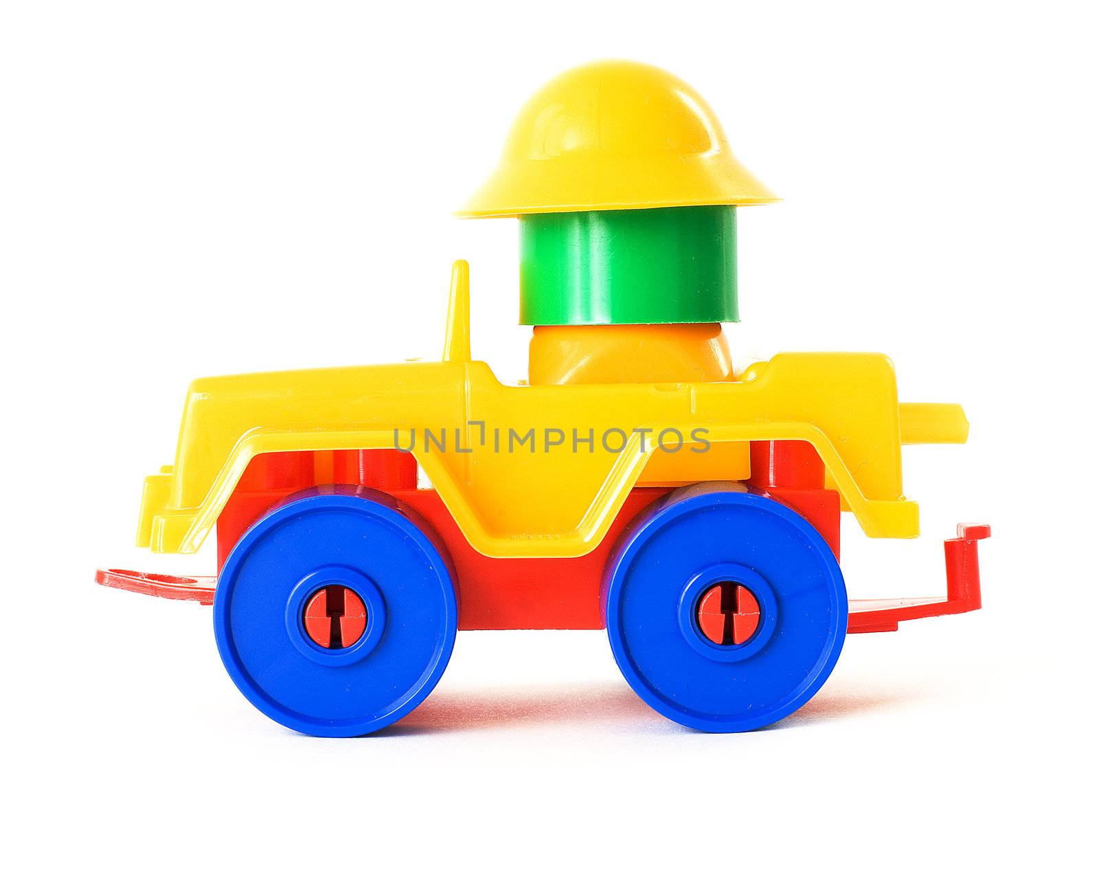 Nursery multi-coloured toy machine on a white background