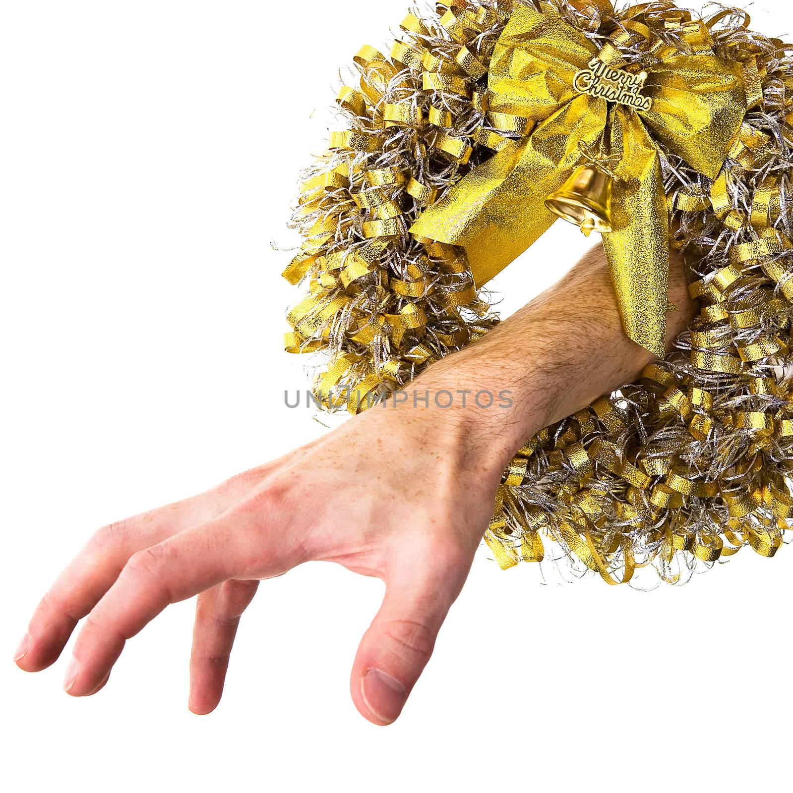 Hand put out from a Christmas wreath on a white background