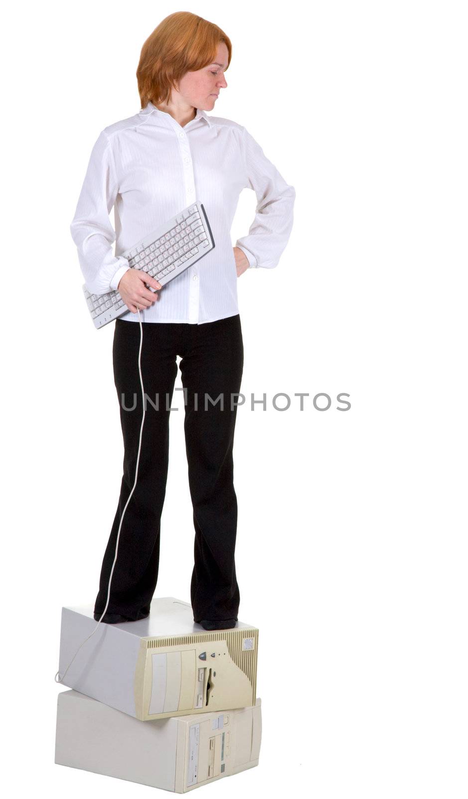 The girl standing on two computers with the keyboard