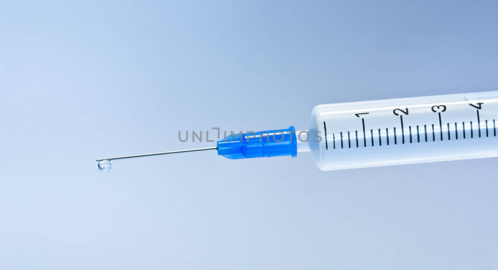 Syringe with blue drop by rozhenyuk