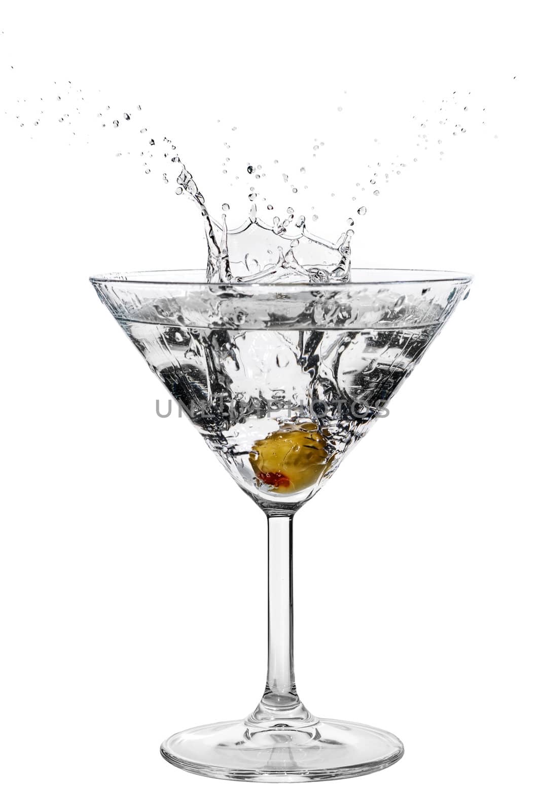 Olive splashing on cocktail isolated on white
