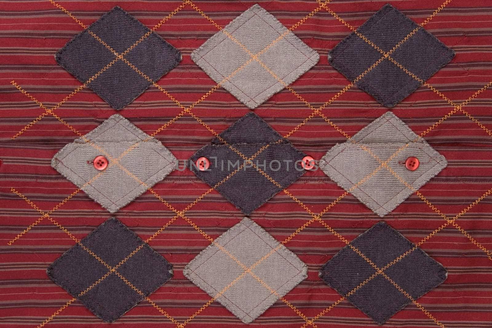 front view of red fabric, striped and grid texture