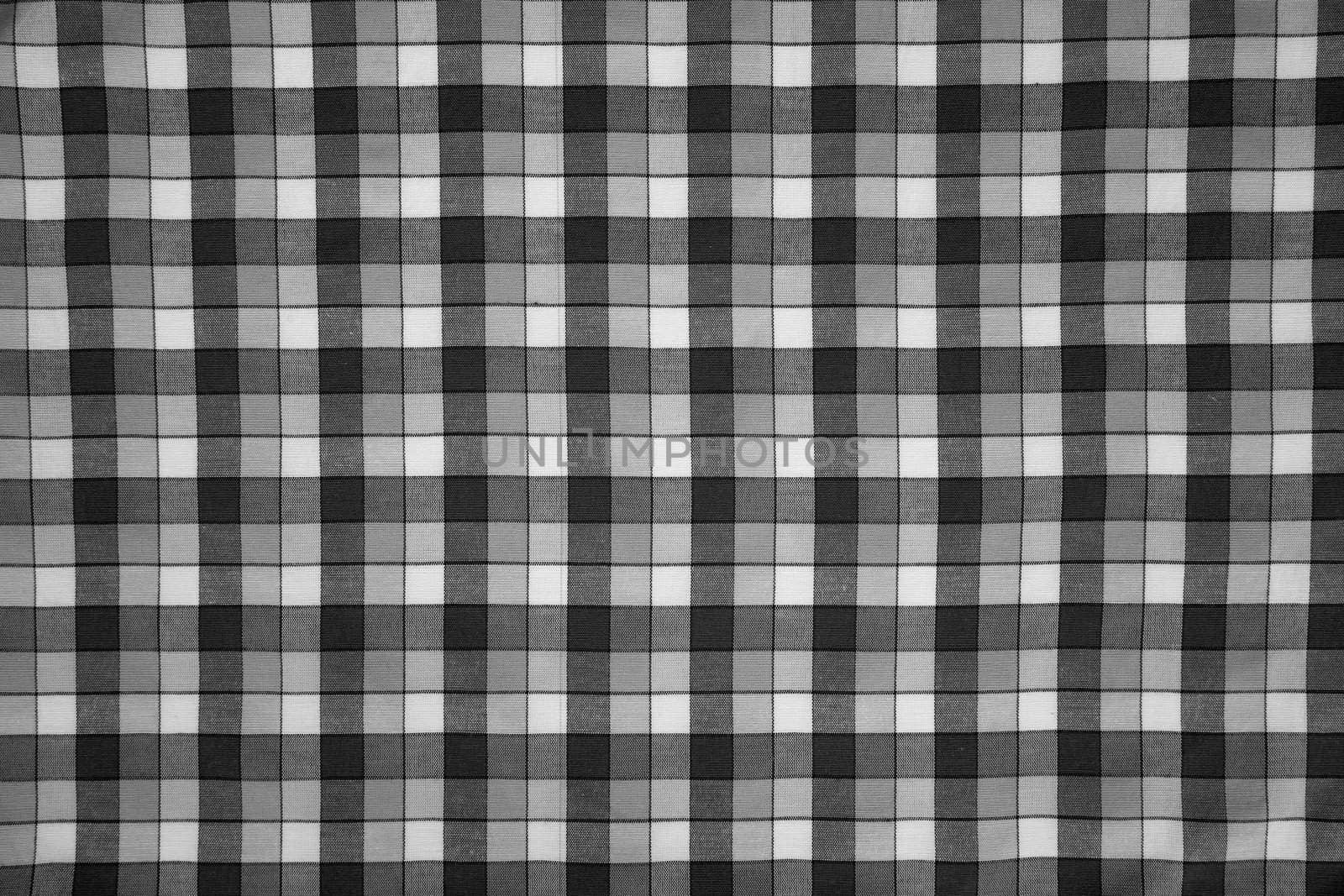 detail of fabric print with black and white grid