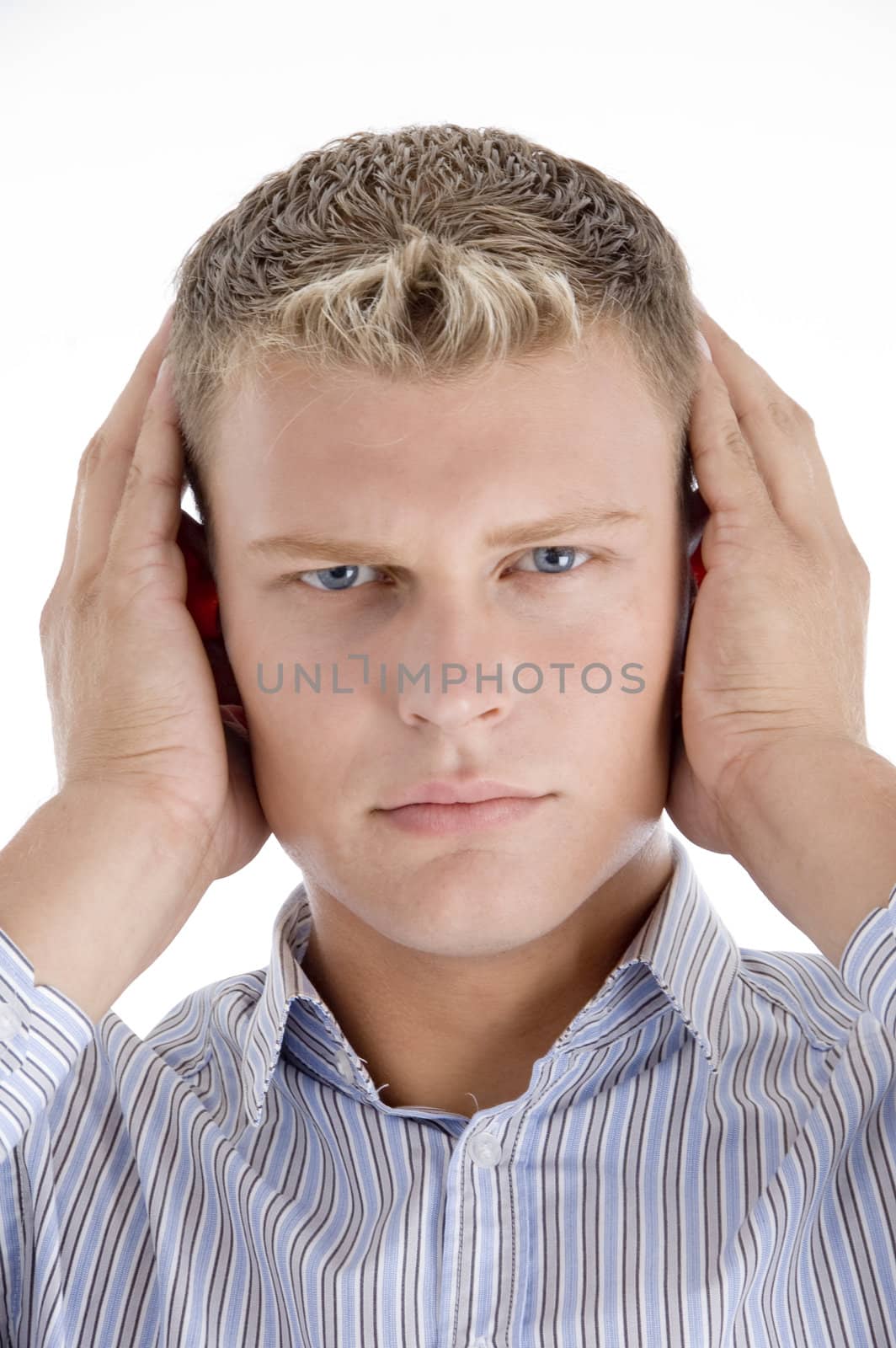 young caucasian man concentrating against white background