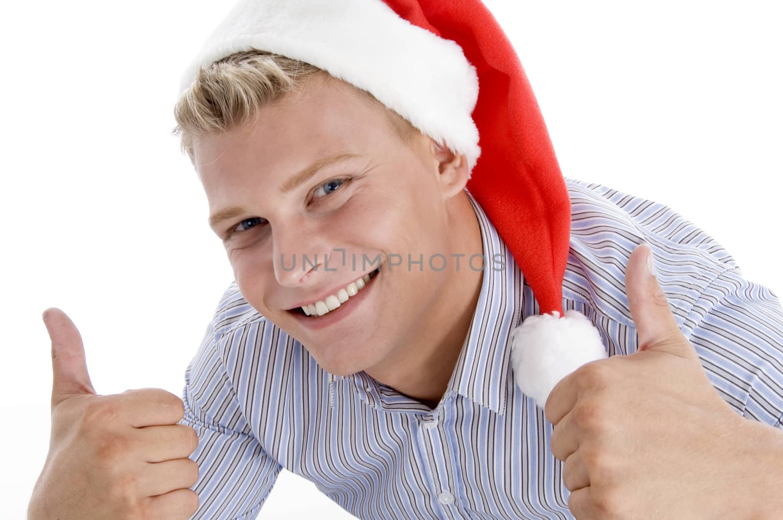 happy man with christmas hat wishing good luck by imagerymajestic