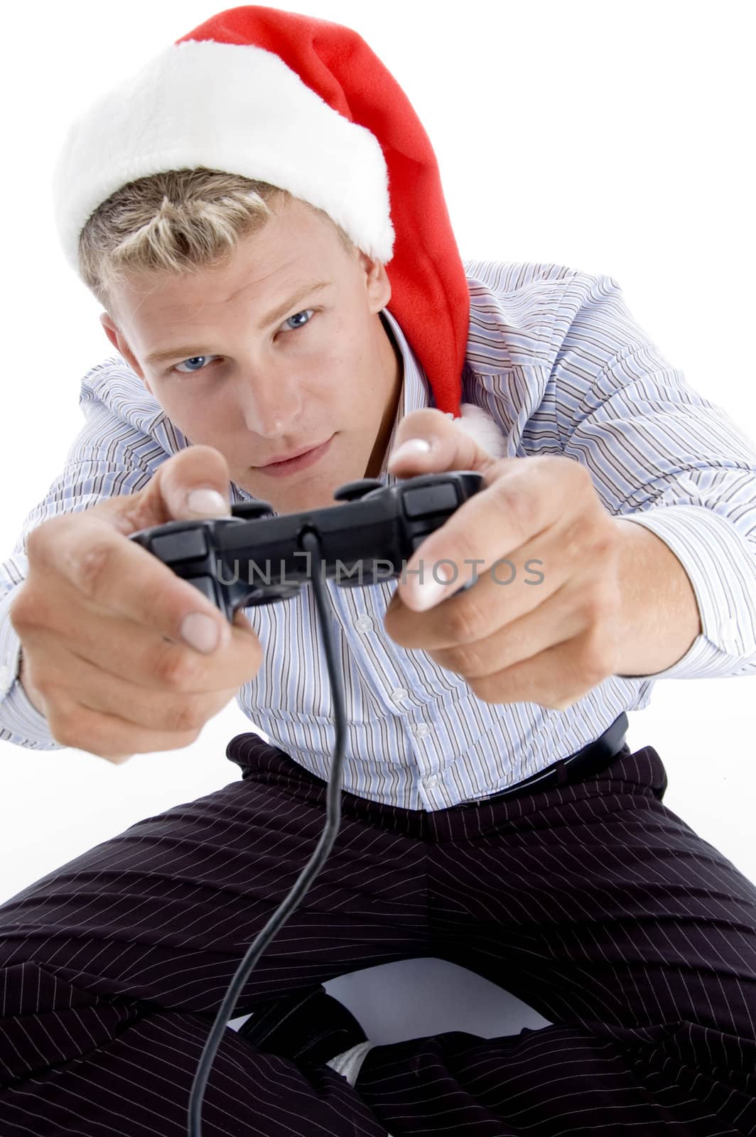 caucasian man with remote and christmas hat with white background