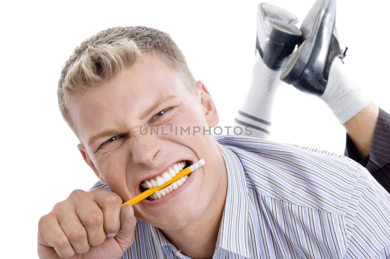 man holding pencil with teeth with white background