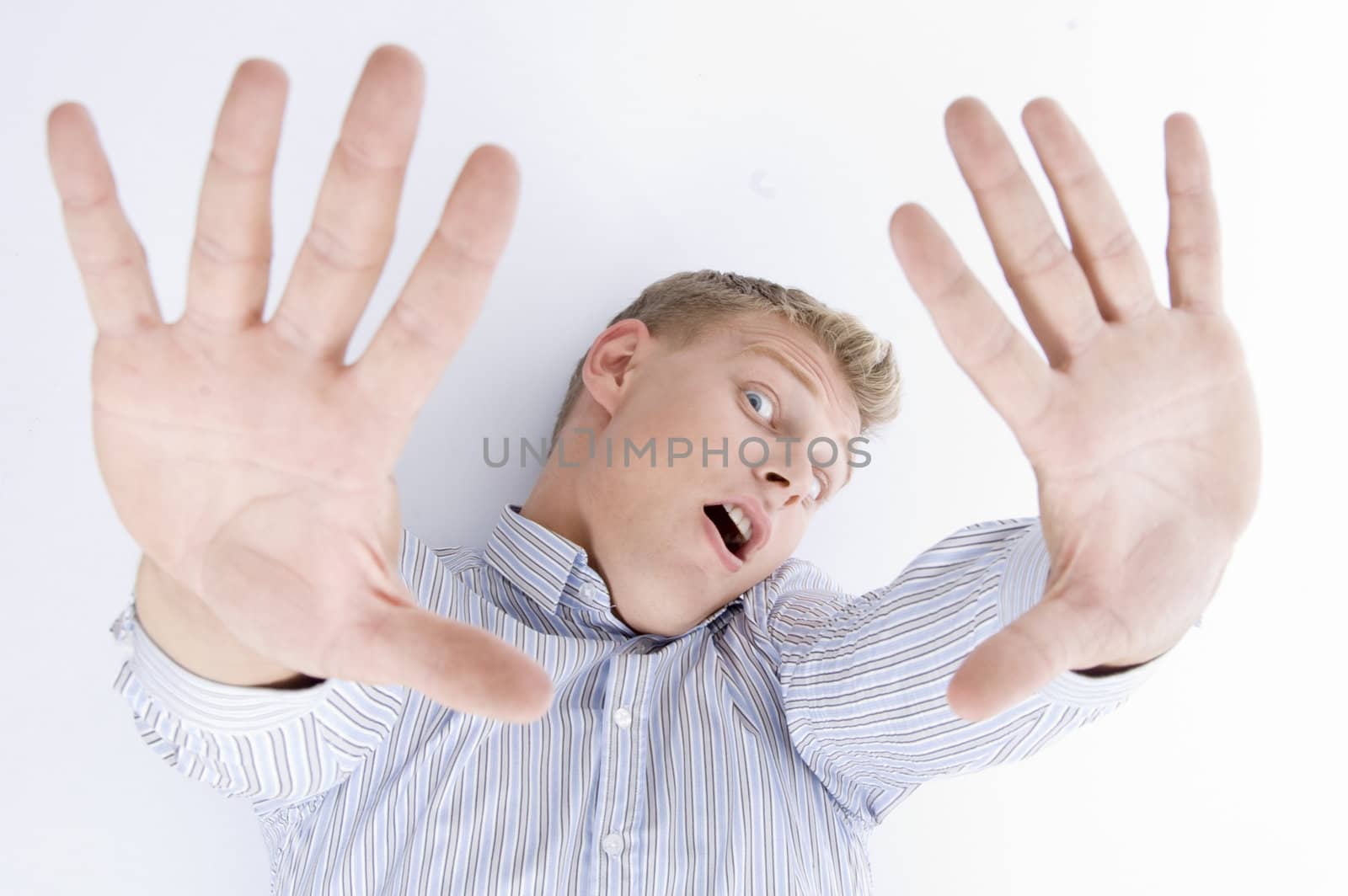 shouting young guy with open palms isolated on white background