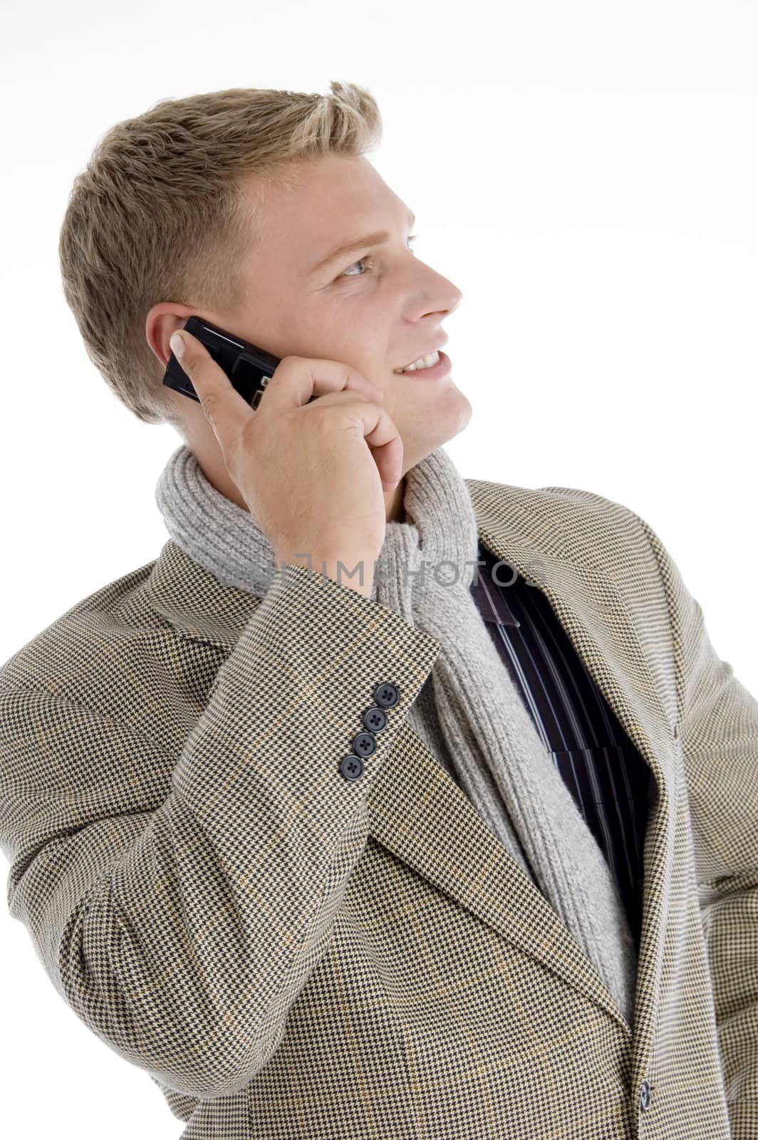 smiling young caucasian interacting on mobile on an isolated white background