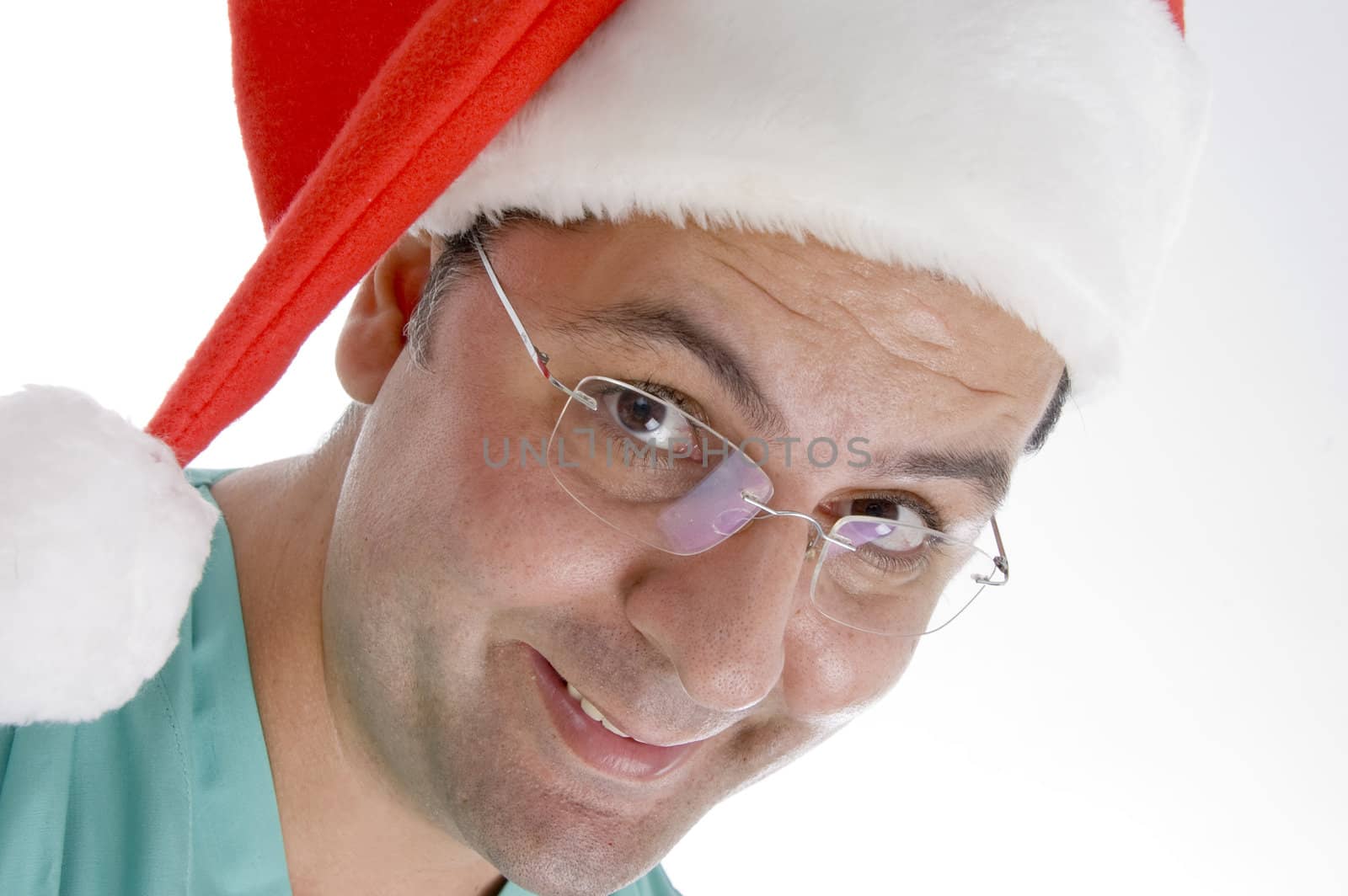 doctor wearing christmas hat against white background