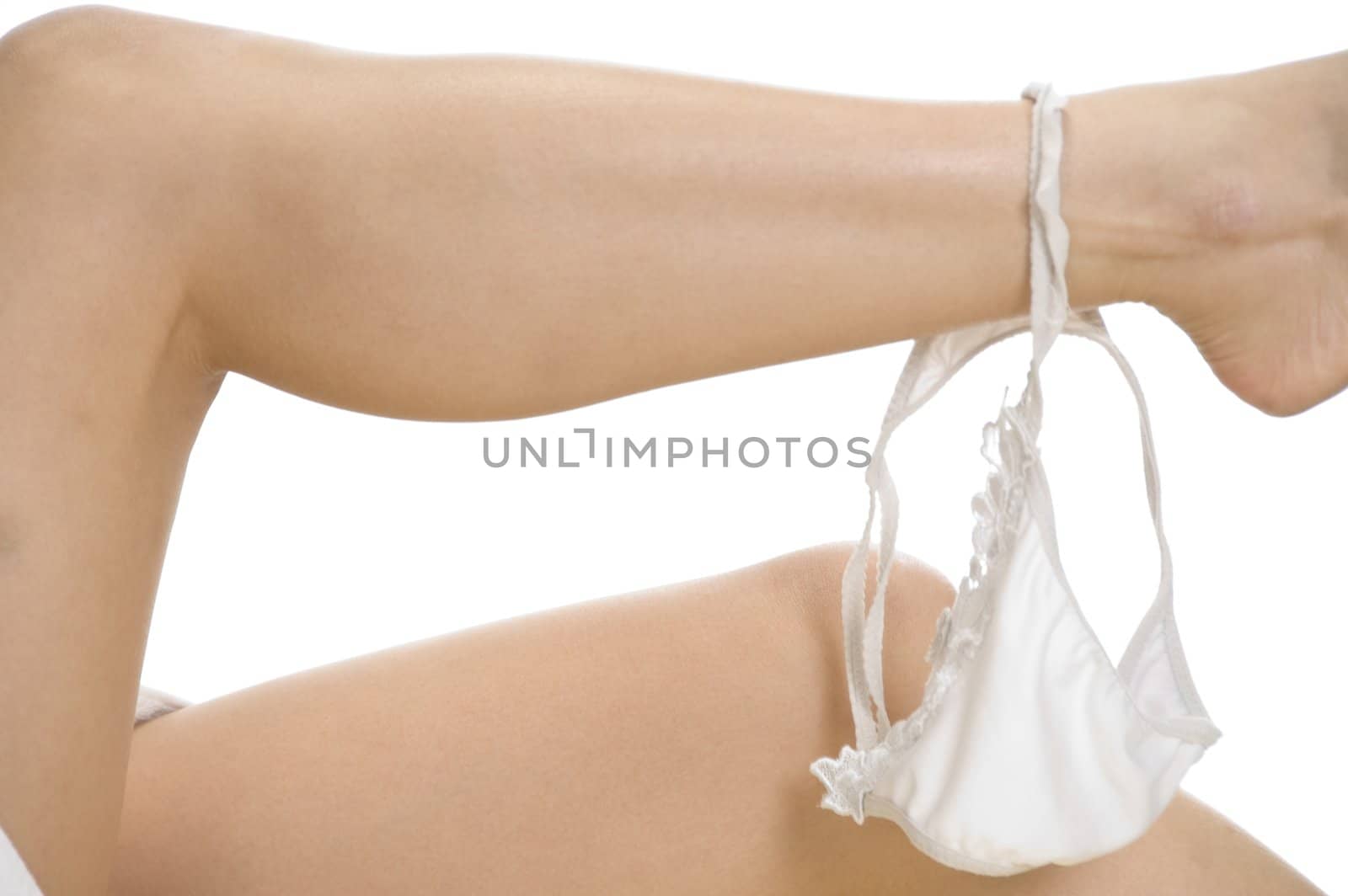 woman taking off her underwear on an isolated white background