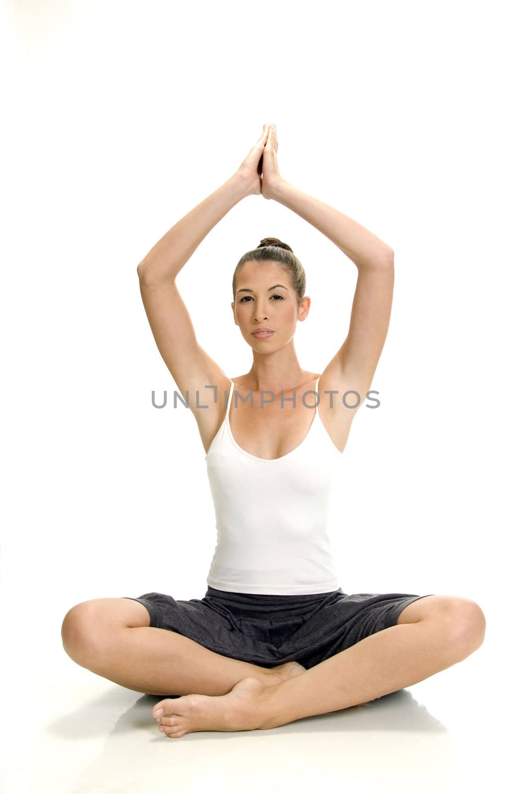 young woman doing yoga on an isolated white background