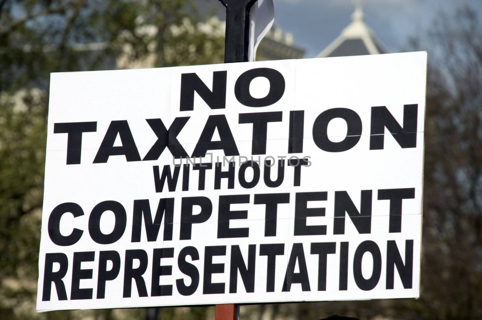 a sign in protest to taxes and the current economic conditions