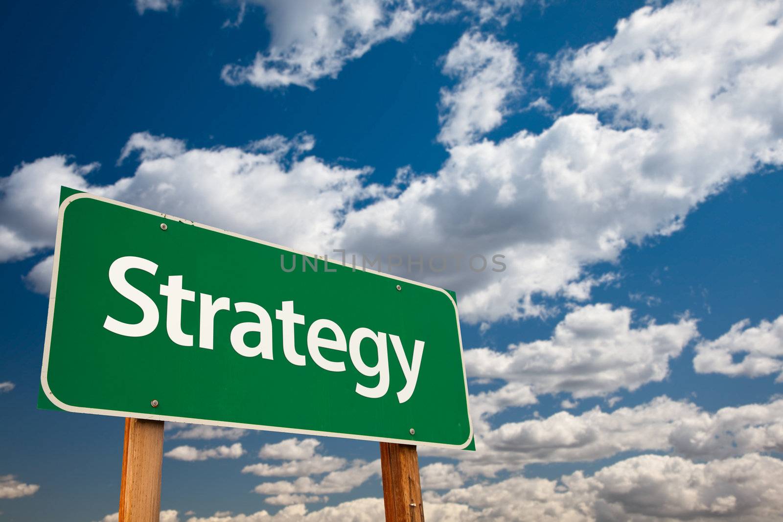 Strategy Green Road Sign with Copy Room Over The Dramatic Clouds and Sky.