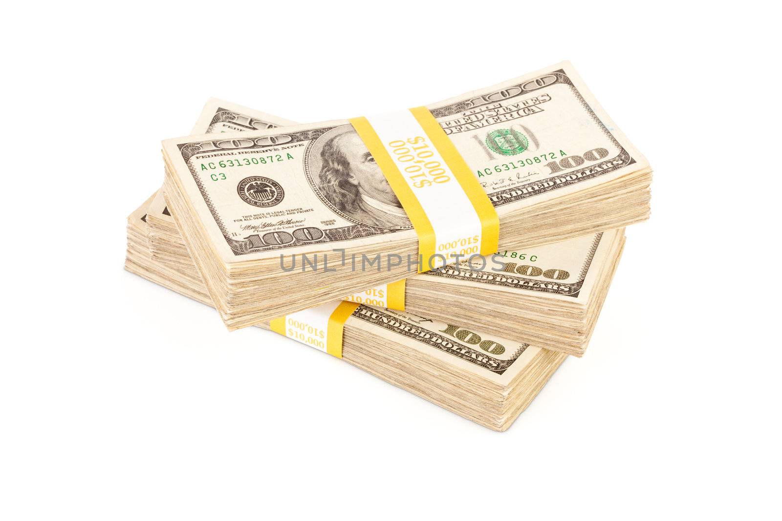 Stacks of Ten Thousand Dollar Piles of One Hundred Dollar Bills Isolated on a White Background.