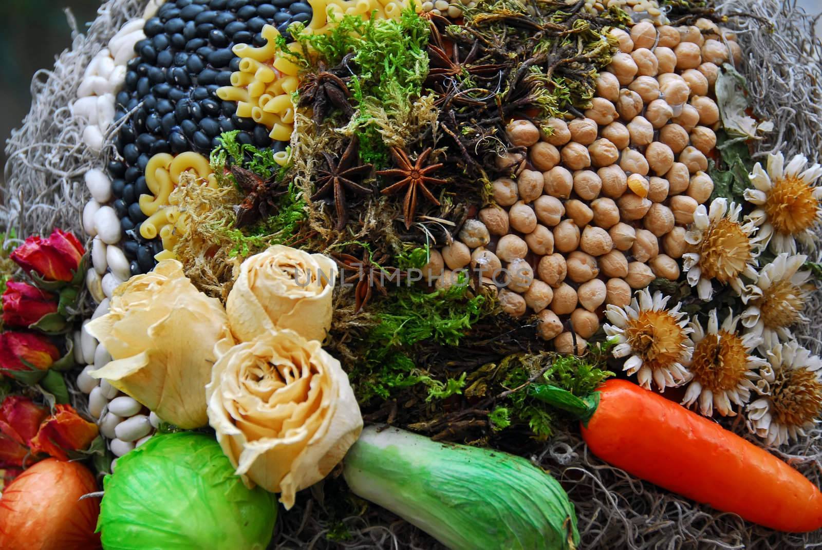 A picture showing several dried flowers and various vegetables