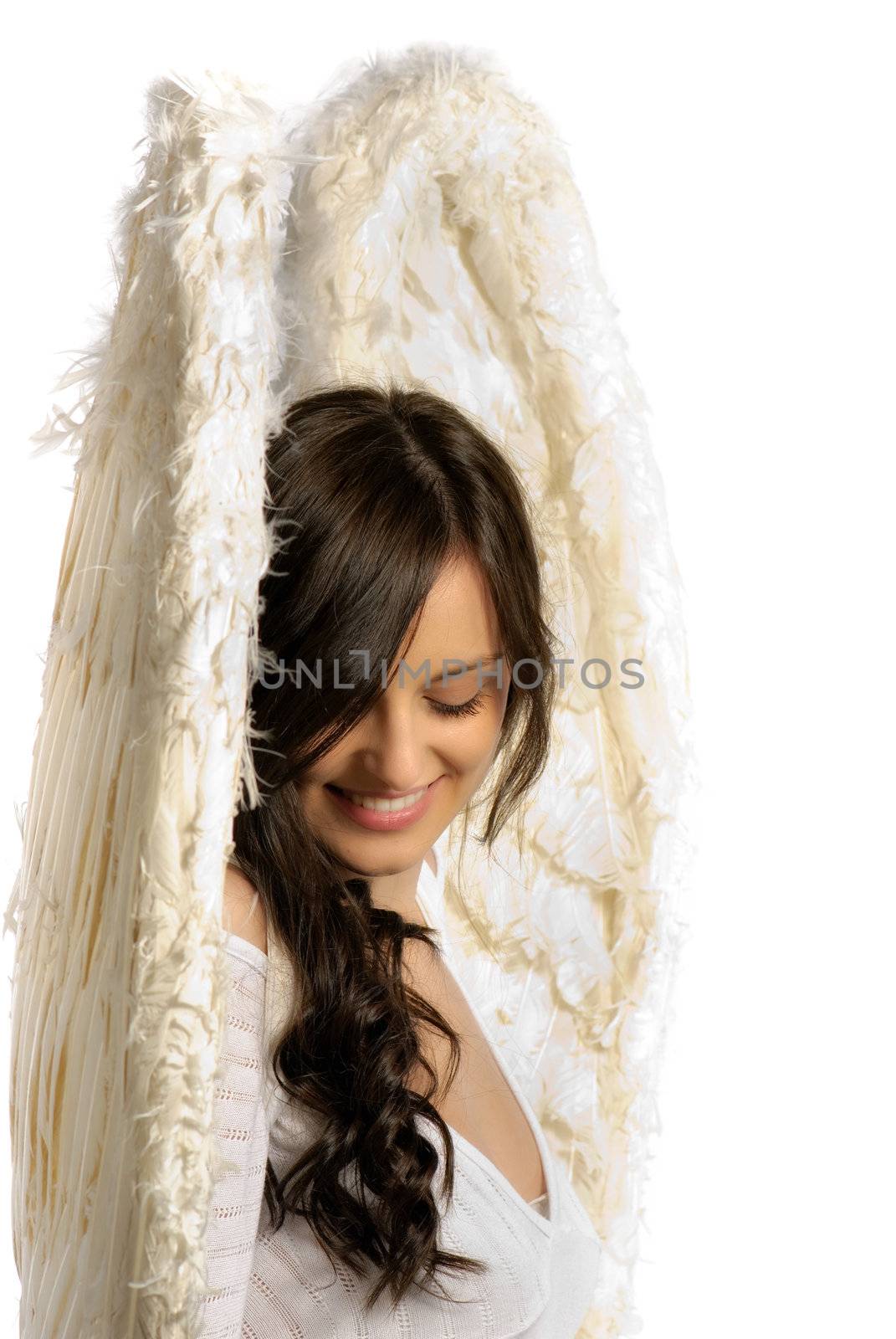 Young woman with angel wings smiling isolated on white