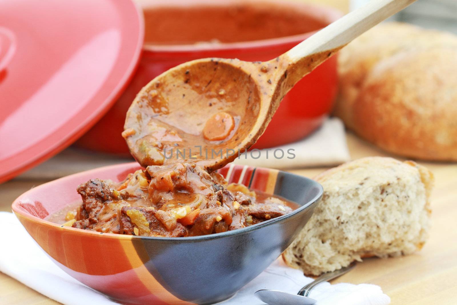 Freshly prepared venison stew with vegetables in a rich broth. Could also be used as beef stew. Extreme shallow DOF.