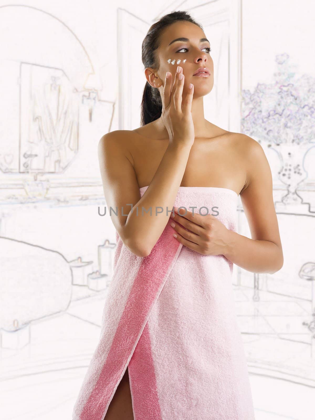 cute brunette dressing a pink towel with cream on her face