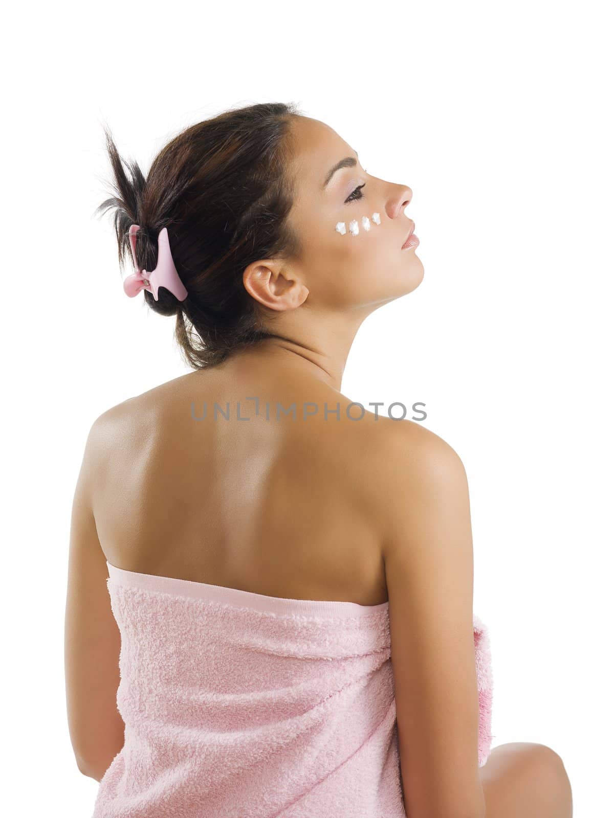 brunette dressing pink towel and point of cream