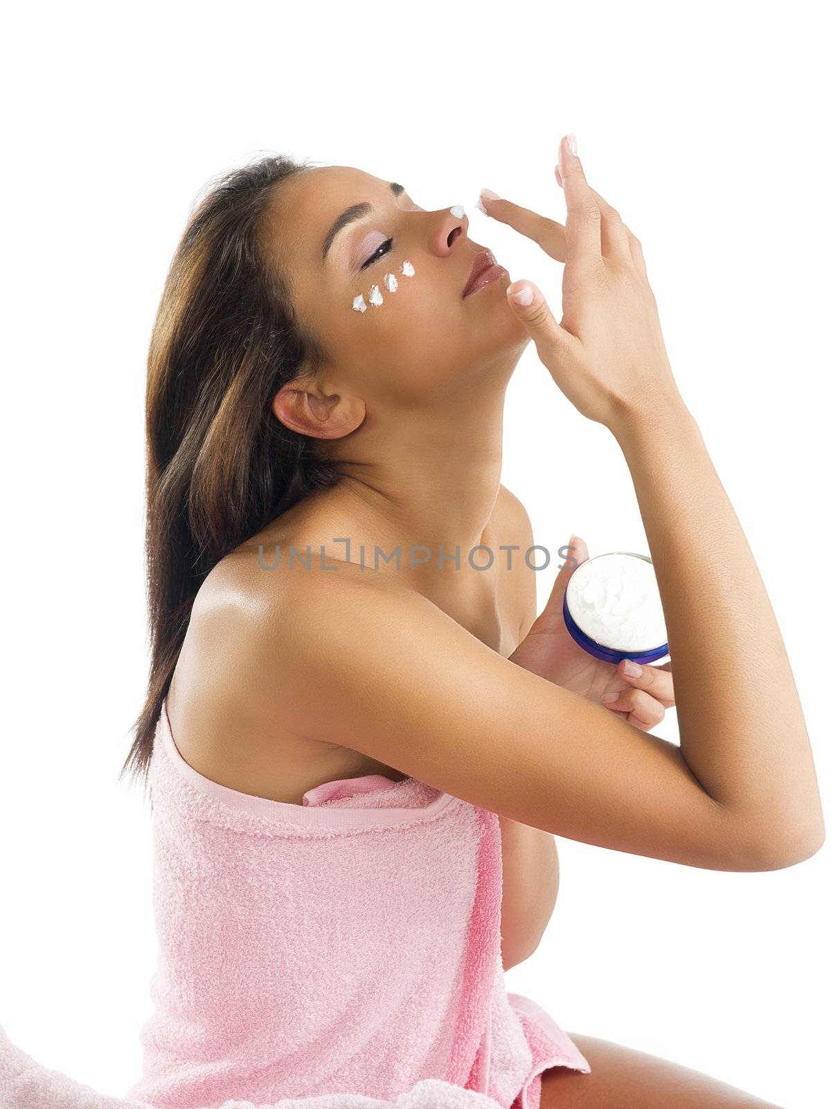 cute young girl with cream on face and on the nose