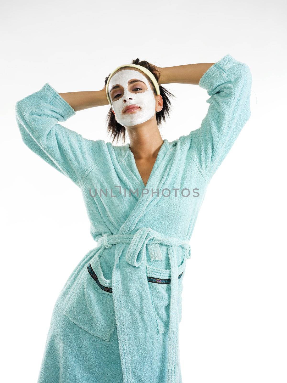 cute and nice girl with face cream mask and posing