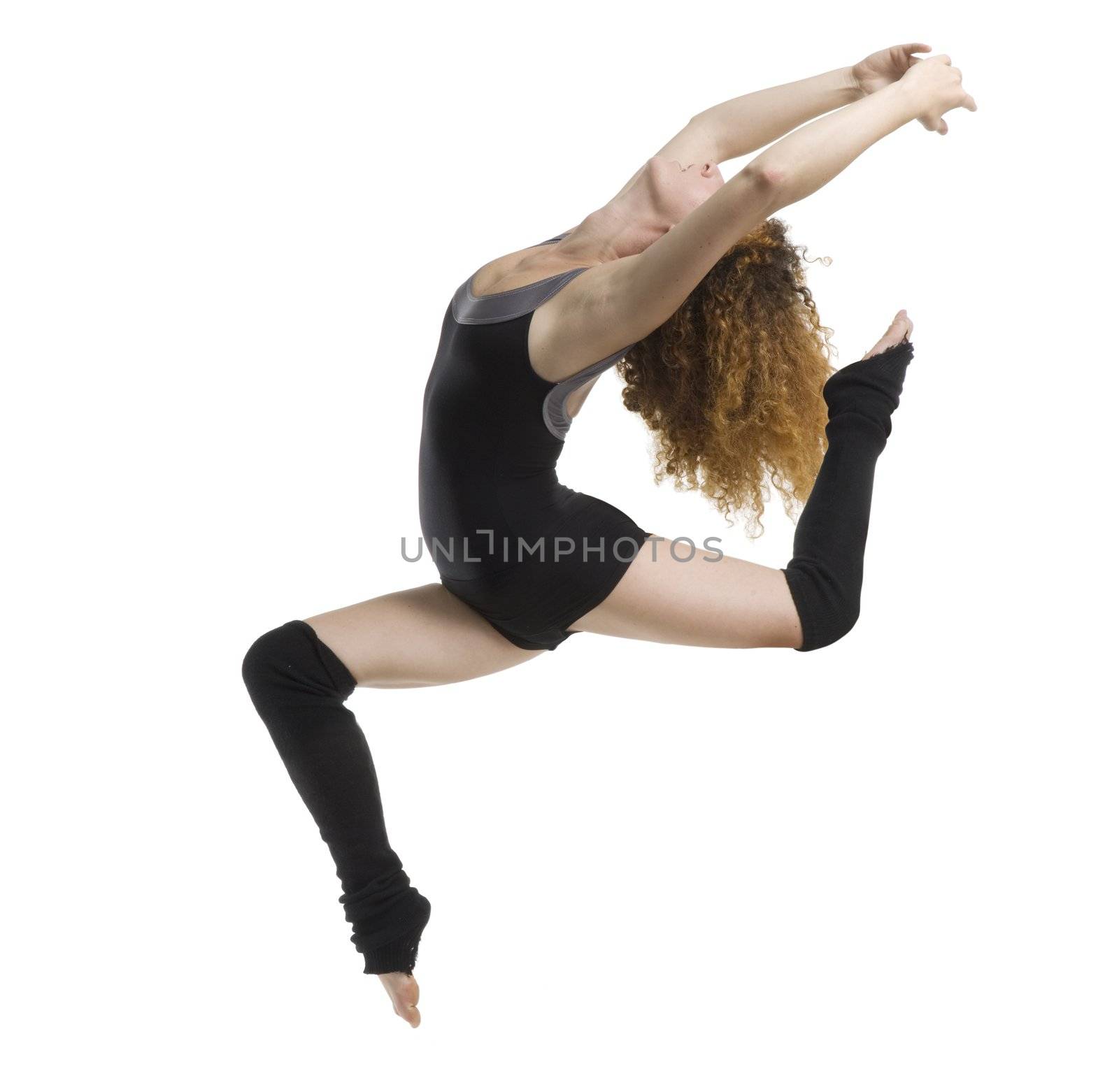 a modern dancer with black dress jumping