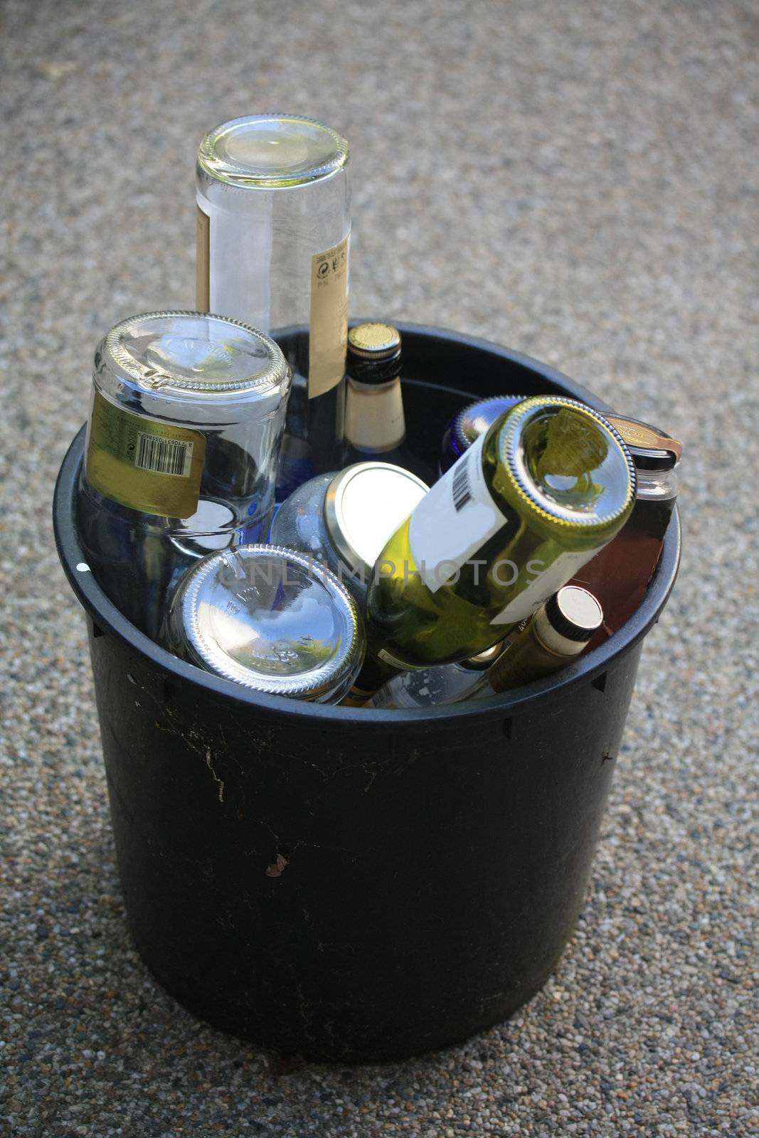 A bucket filled with empty bottles