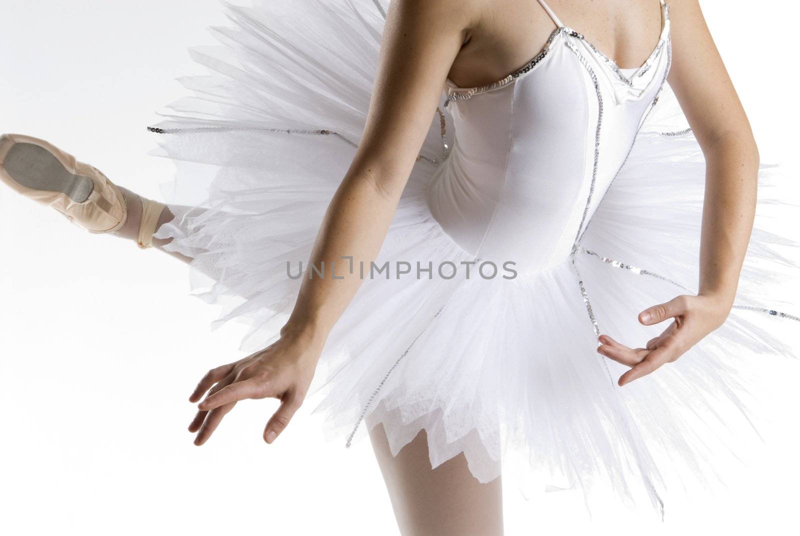 dancer in a white tutu on a white background