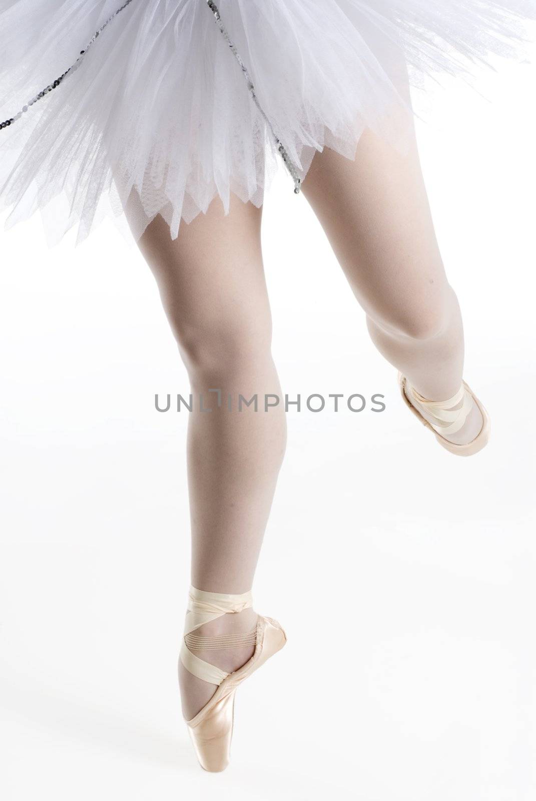 dancer in a white tutu on a white background