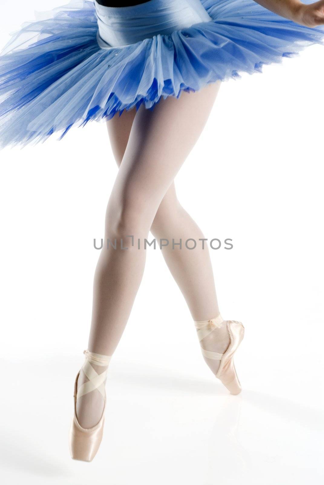 dancer i blue tutu dancing in pointe