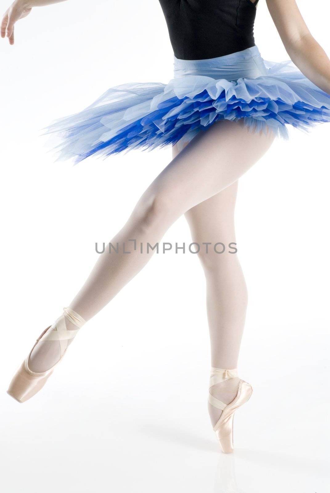 dancer i blue tutu dancing in pointe