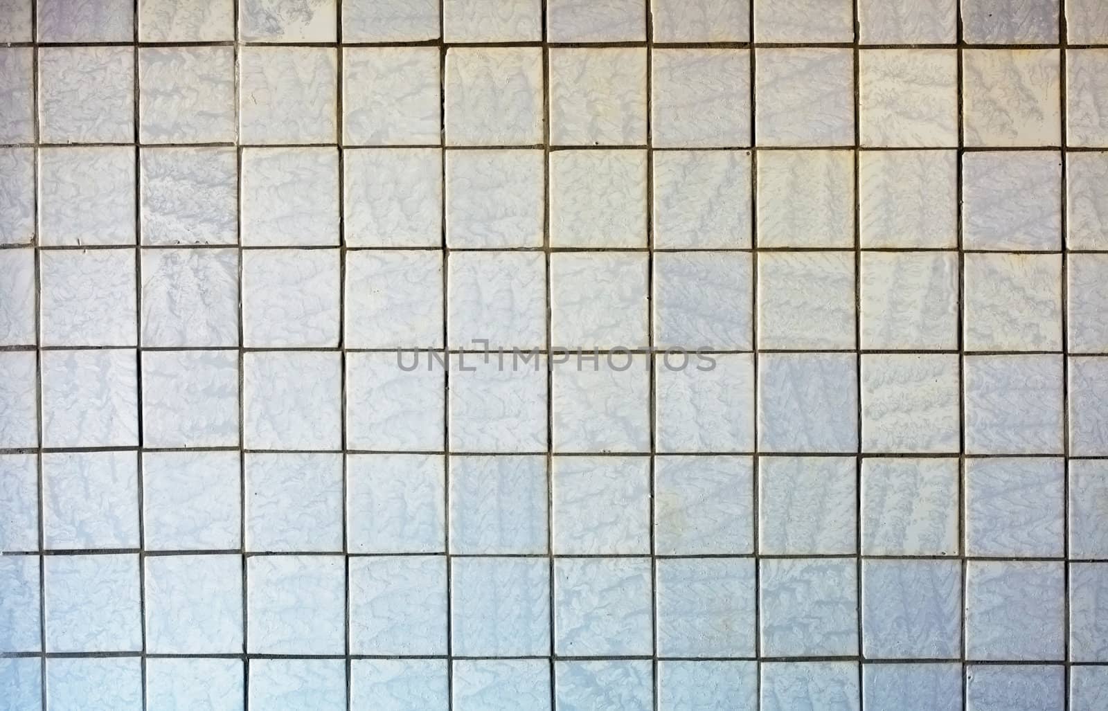 Wall covered with an old grey tile - a background