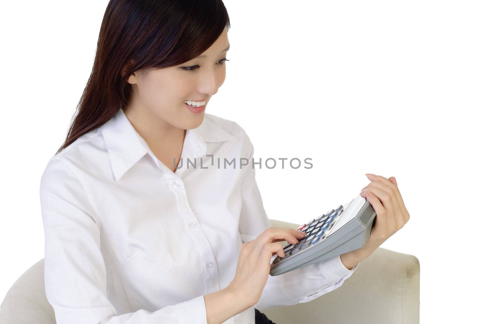 Beautiful Asian business woman with calculator on white background.