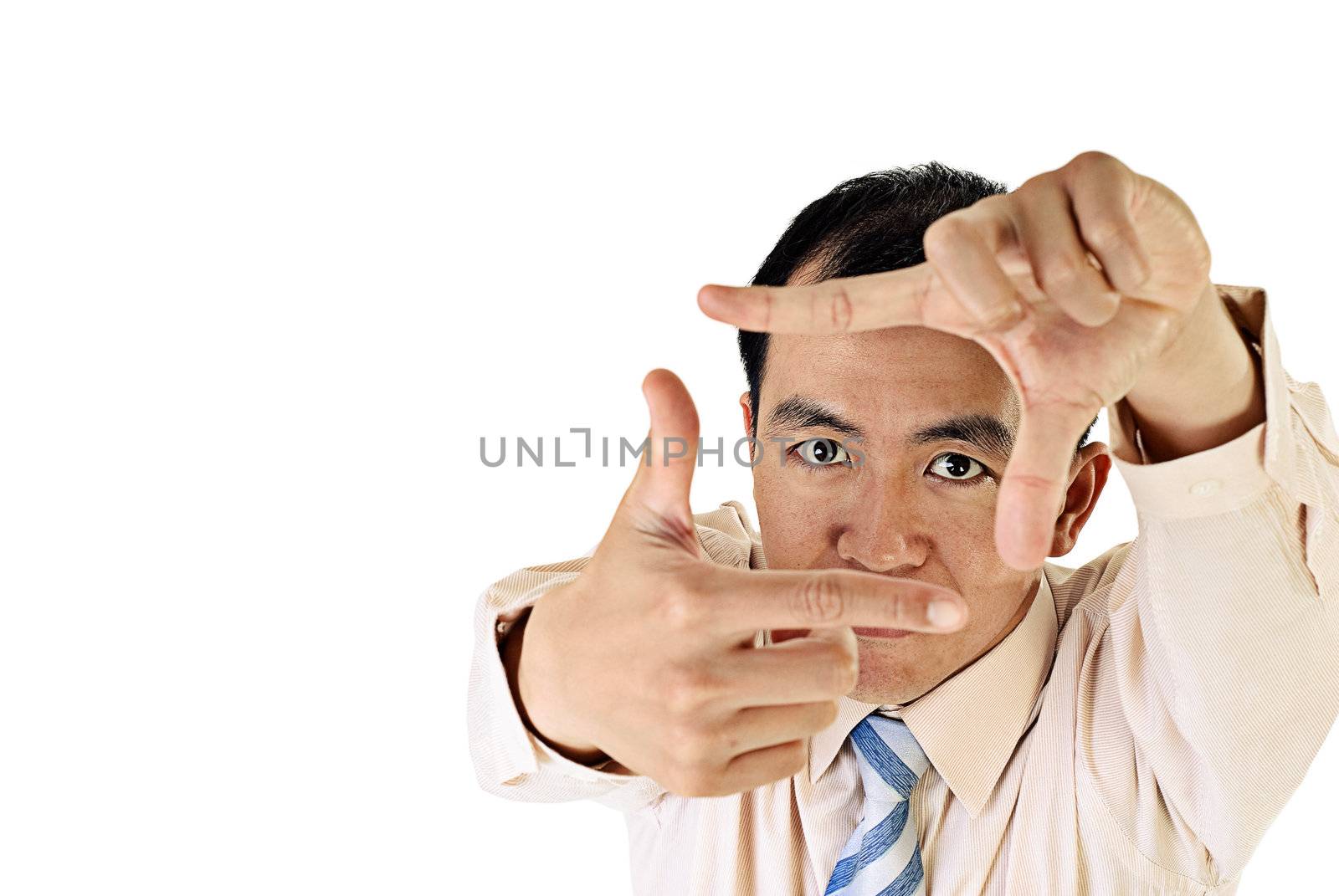 Asian business man portrait with focus on eyes on white background.