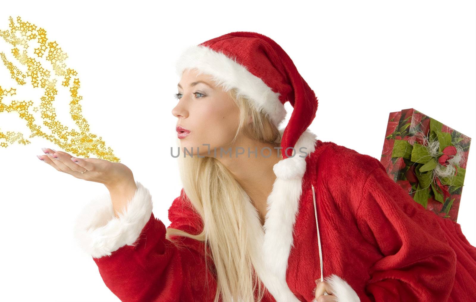 close up of a blond santa clause blowing on star dust in hand