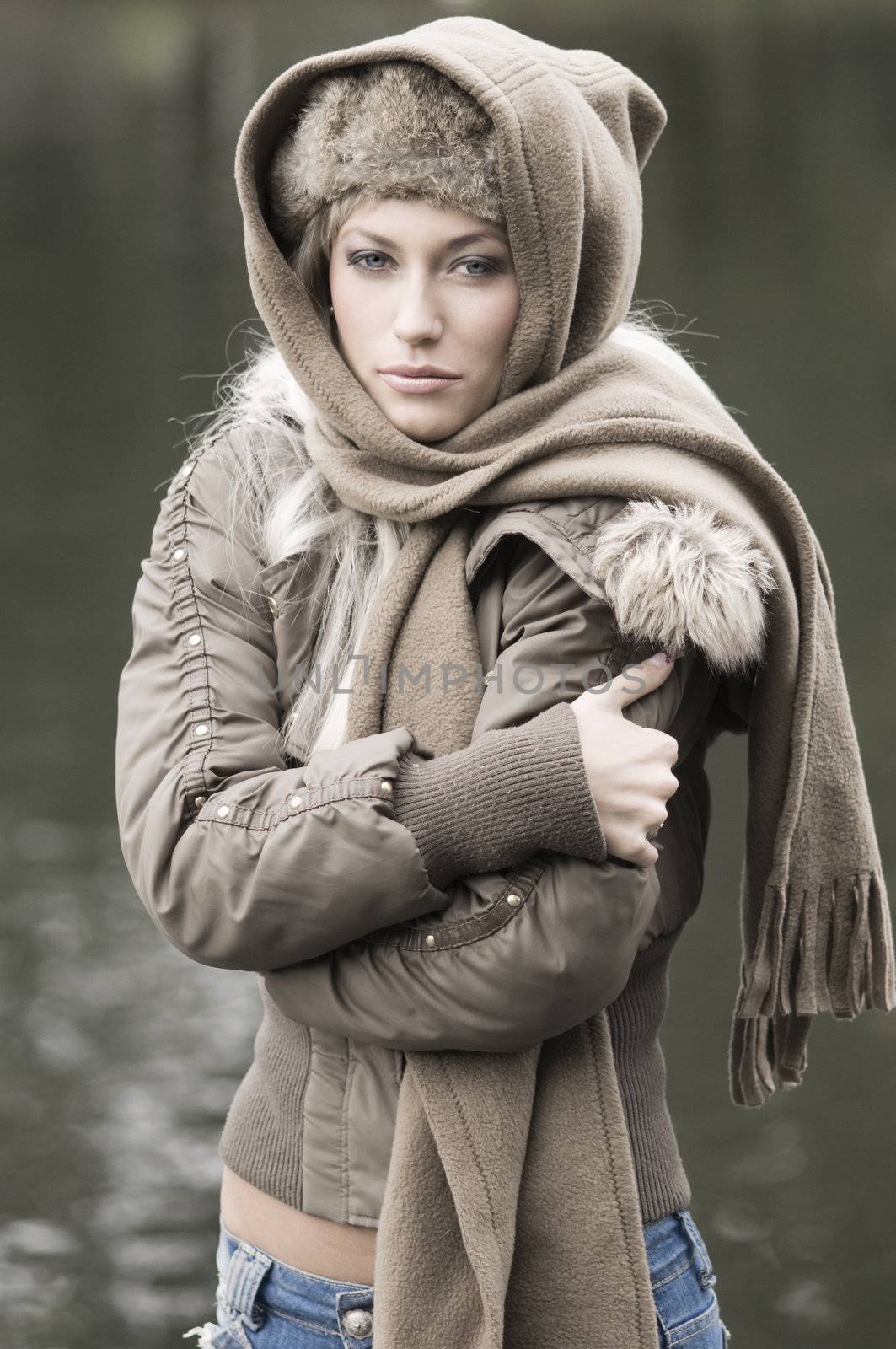outdoor portrait of a young woman with an head scarf for cold