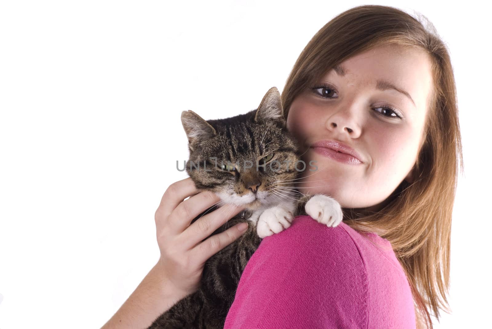 Pretty teenage girl holding her cat, isolated on a white background.