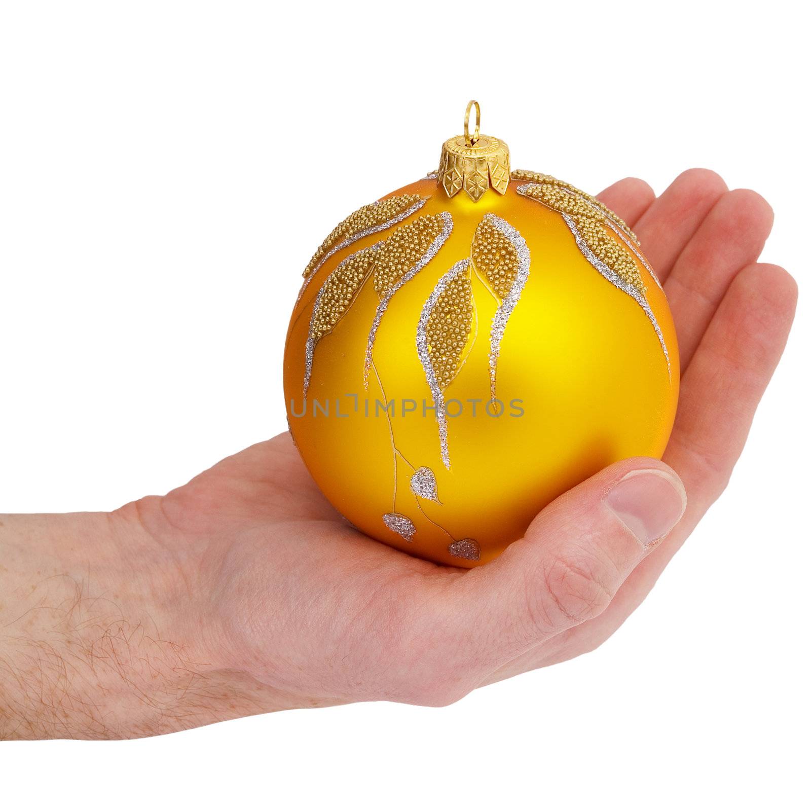 Cristmas tree golden ball in the hand on the white background