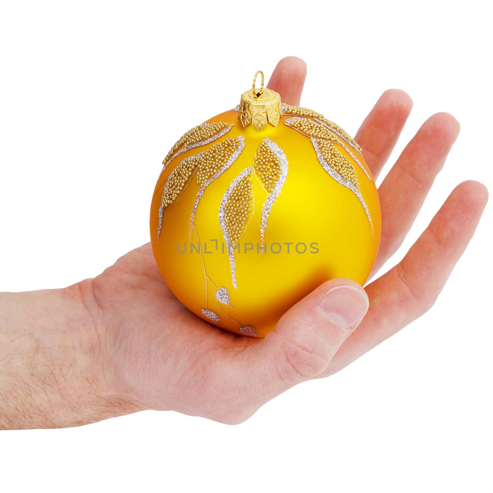 Cristmas tree gold ball on the hand