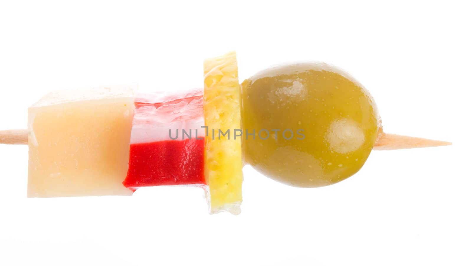 close-up canape with olive, lemon, crab meat and cheese, isolated on white