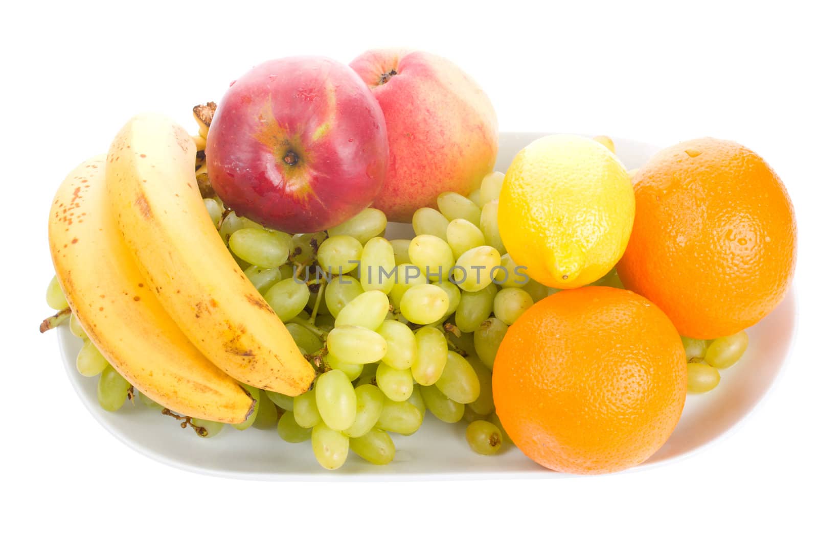 close-up fruits on plate, isolated on white