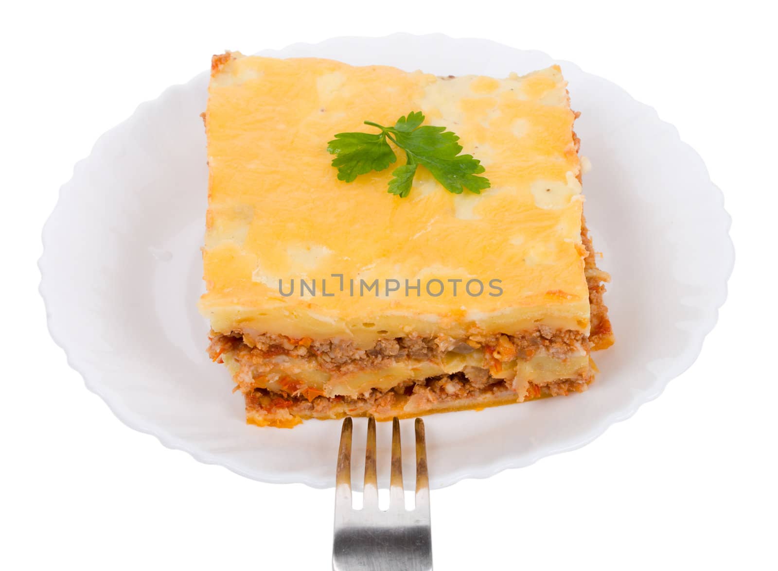 lasagne on plate with fork, isolated on white