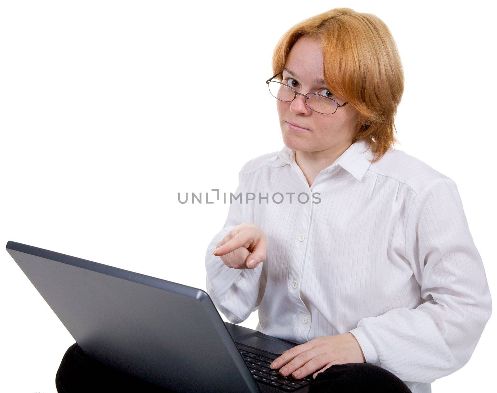 The girl working on the black laptop on a white background